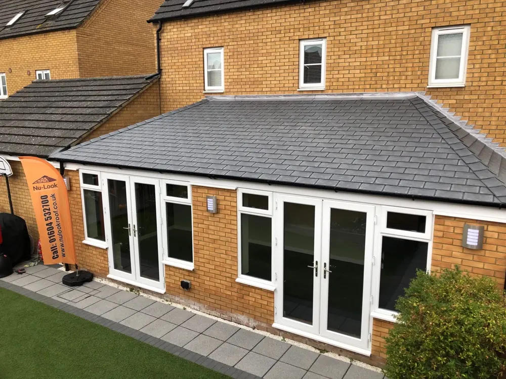 Hipped lean-to conservatory with a tiled roof fitted by Nu-Look
