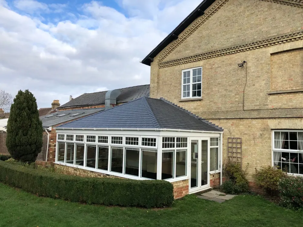 Edwardian conservatory with a grey tiled roof fitted by Nu-Look
